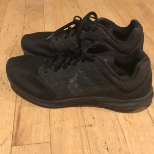 Black Nike training shoes